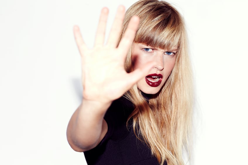 Angry refusal from young woman.