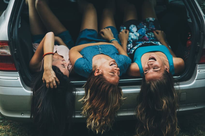 friends laughing car outside summer