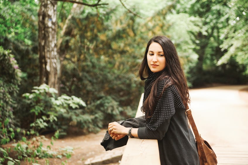 Vintage toned portrait of a young woman in Tiergarten park