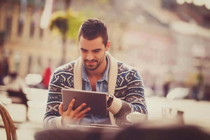 Young male blogger outside