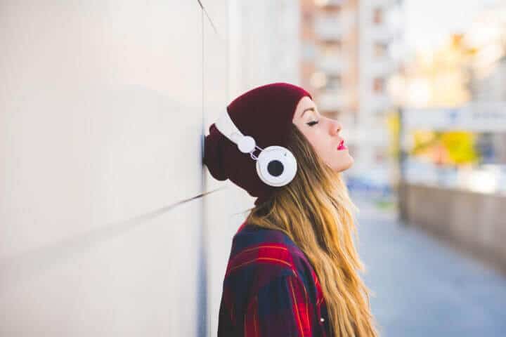 woman headphones street city