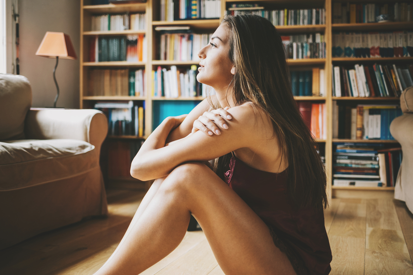Brunette sitting in library