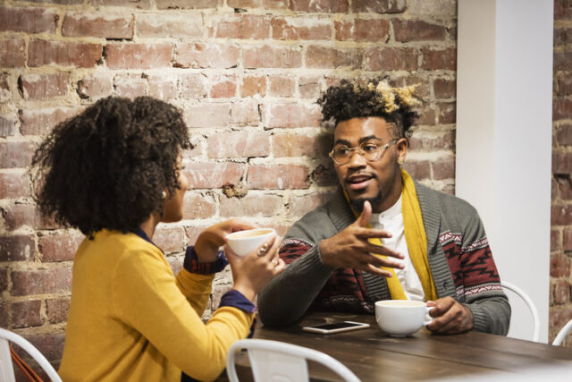 couple having serious convo at cafe