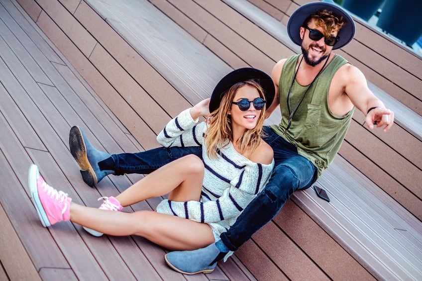 Hipster man showing something to his girl