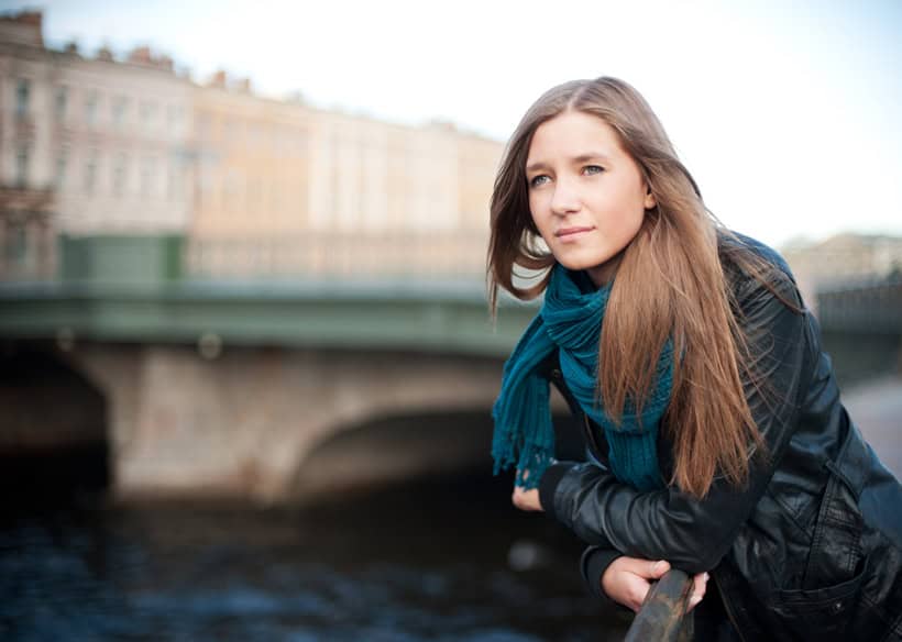 Pensive girl on the quay
