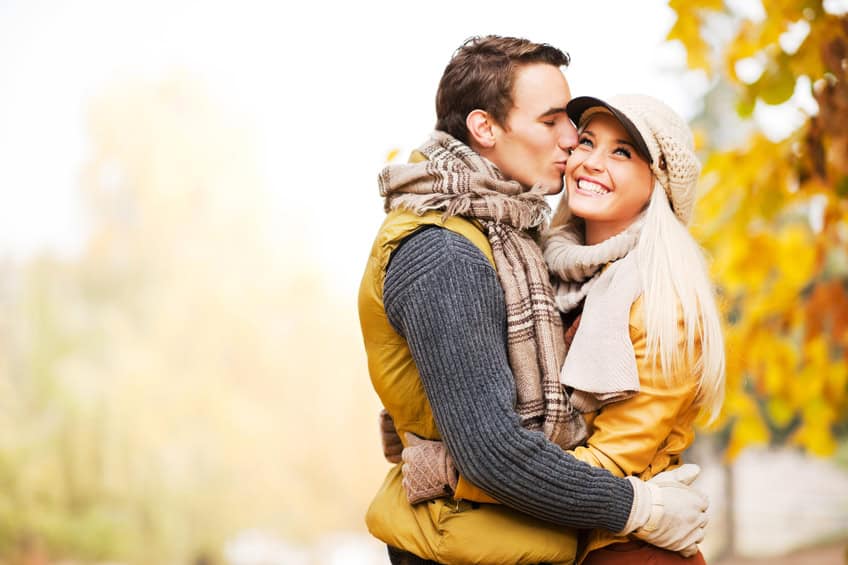 Beautiful couple enjoying in the beautiful autumn day.