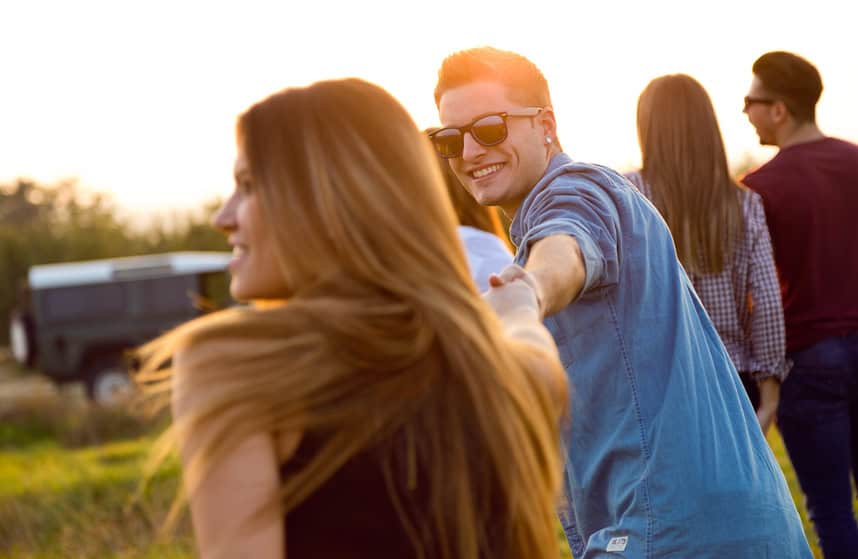 couple party friends outdoors sun