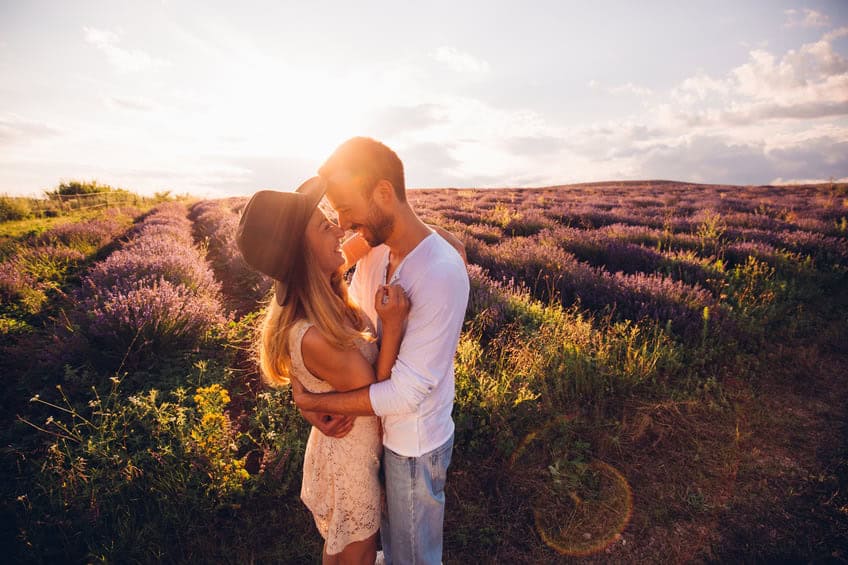 young couple romance sunset kiss