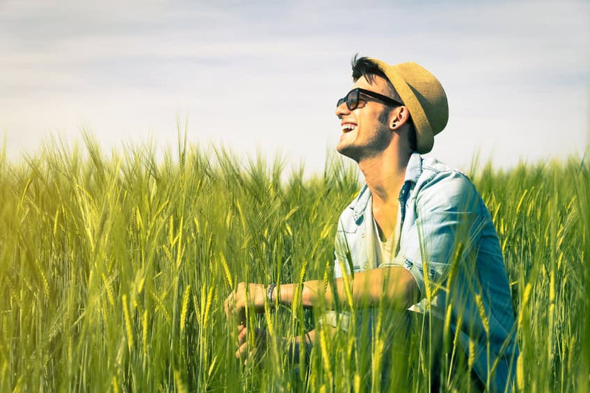 Handsome man is smiling in the countryside