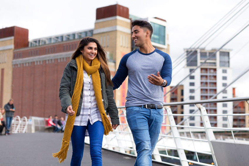couple walking date outside city