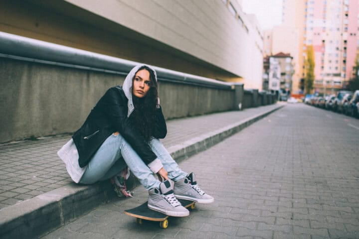 woman skateboard sad outdoors