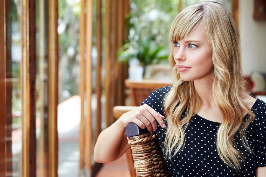 Thoughtful young woman looking away