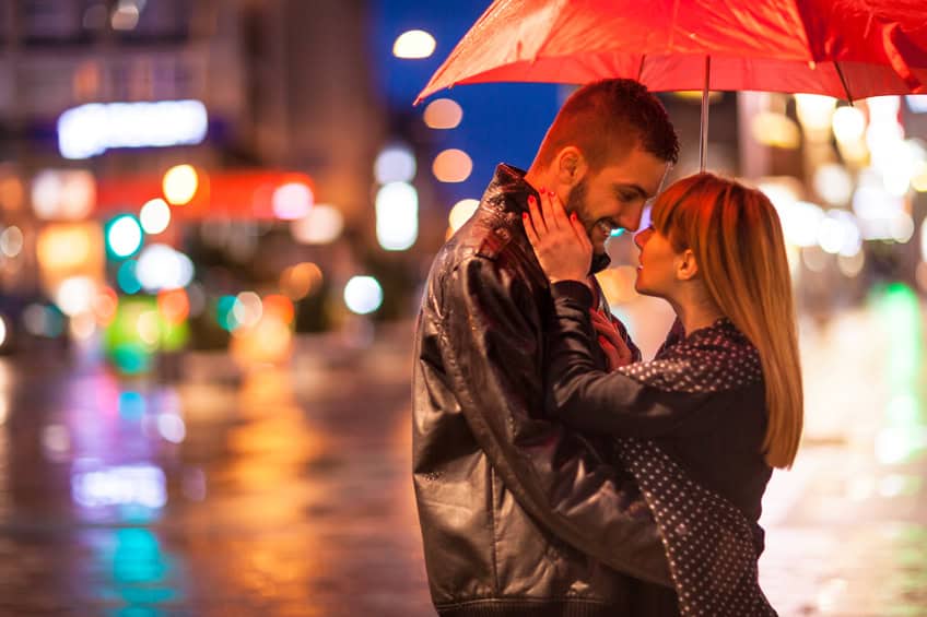 couple romance kissing rain