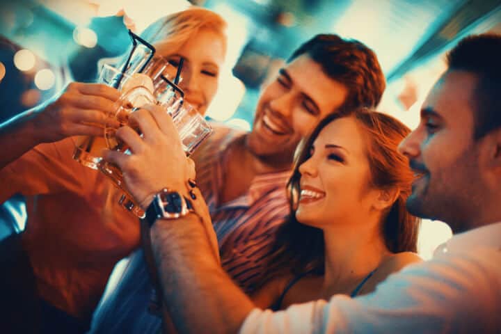 men women bar party drinks