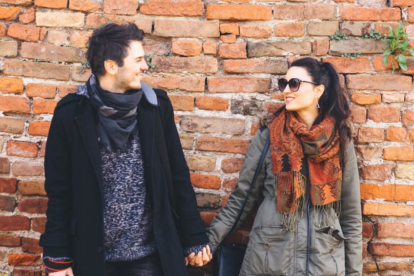 couple holding hands winter happy