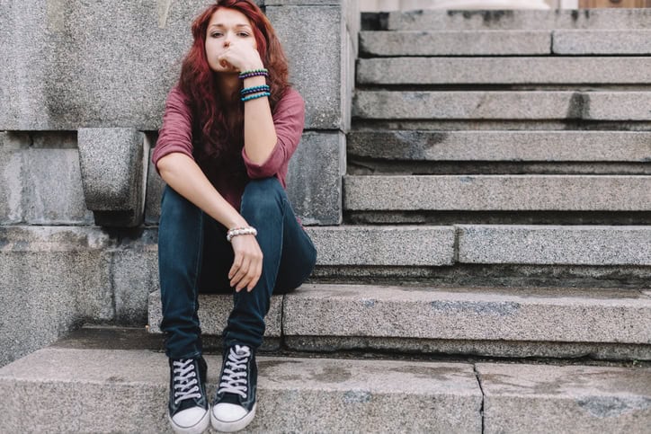 sad young woman outdoors portrait
