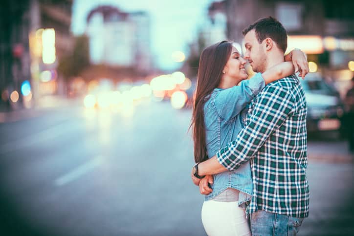 Young couple in love enjoying their time together outdoors at night