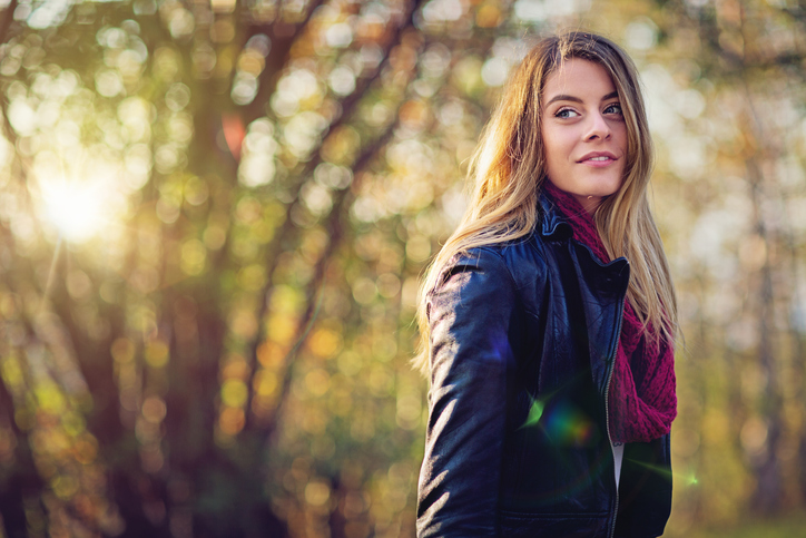Portrait of a beautiful woman in the autumn forest