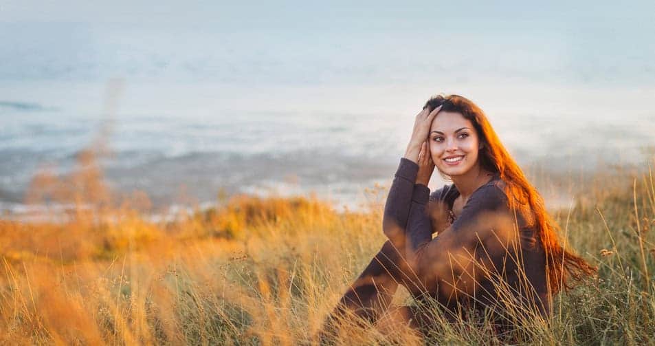 woman smiling beach portrait cold