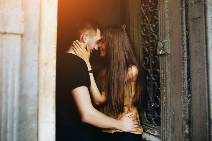 couple posing in the doorway posing on camera