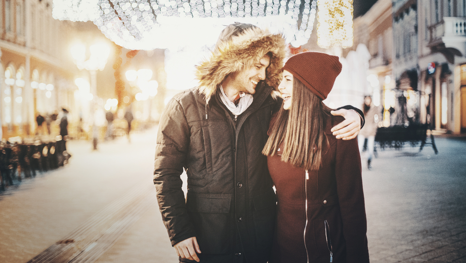 Couple having romantic walk on winter night.