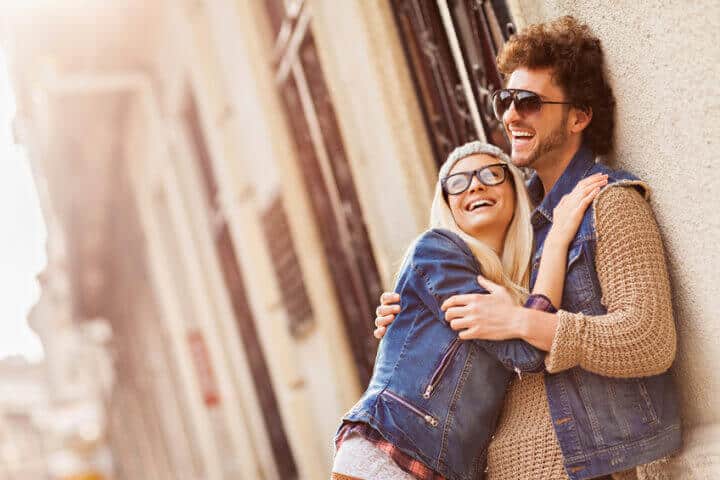 Close up of a happy young couple enjoying city life.