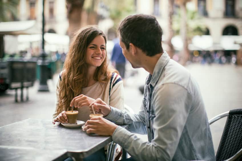 Couple having coffee outdoors