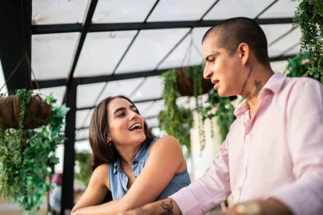 couple flirting at rooftop restaurant