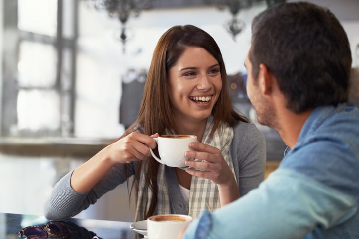 A loving young couple at a coffee shop together