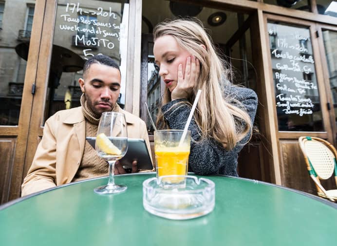 Young Couple having a Serious Discussion at an outdoor Cafe