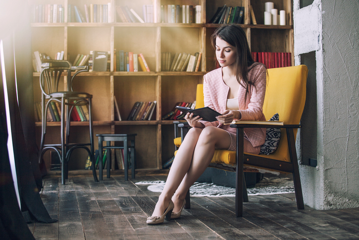 young woman reading library professional