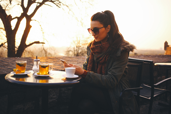 woman cafe coffee winter sunset