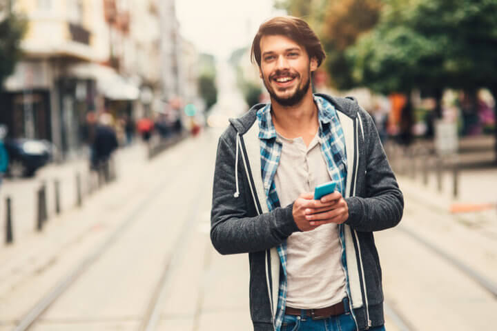 Portrait of a man with casual clothes in urban scene.
