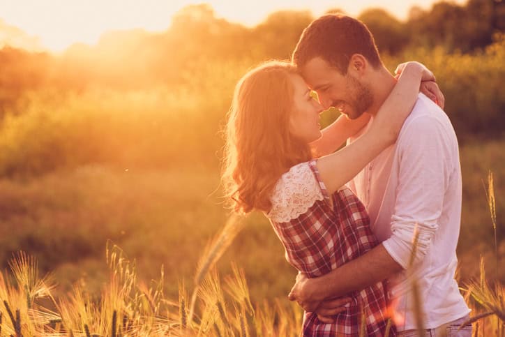 Love in a meadow sunset