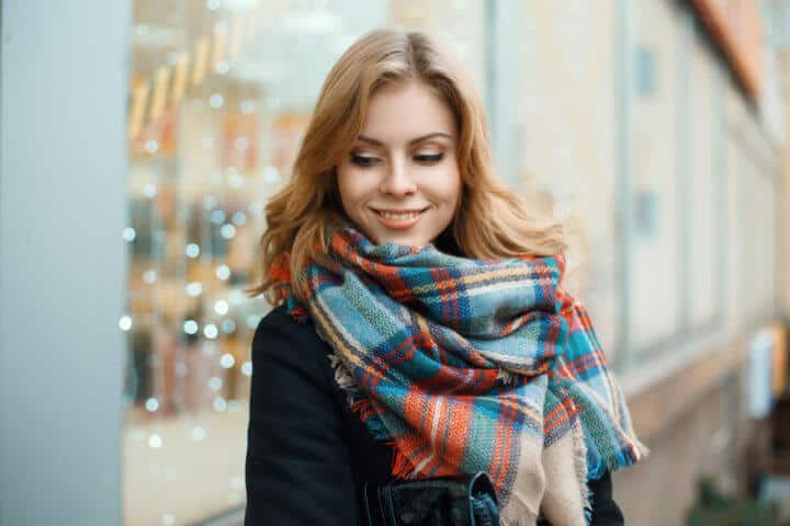 young woman happy outdoors portrait scarf
