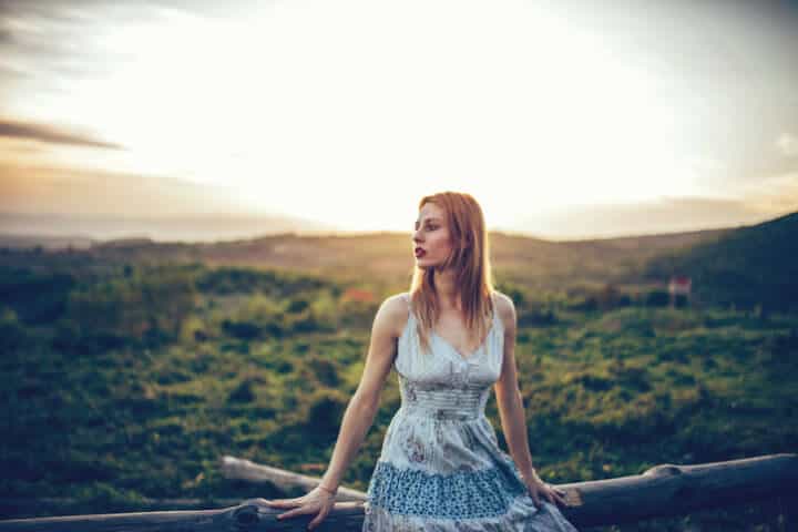 Woman leaned on The wooden fence outdoors