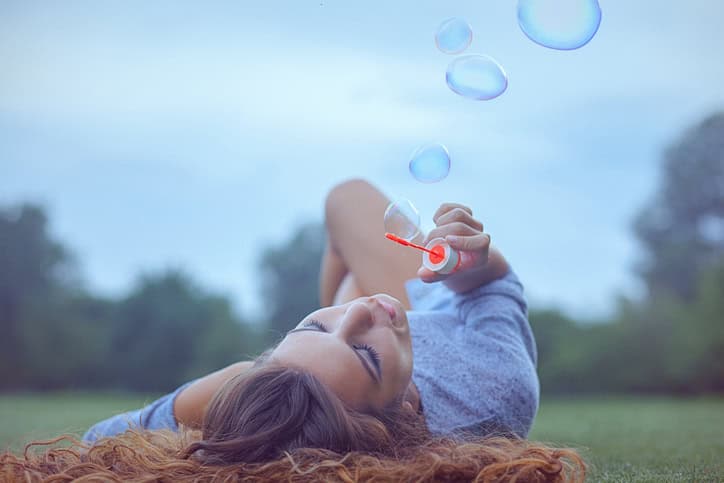 young woman grass summer portrait