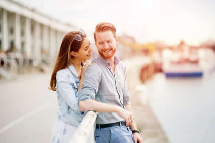 Couple in love sharing emotions in beautiful sunset
