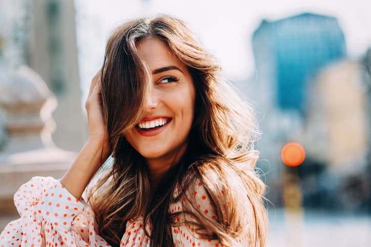 Woman walking outdoors.
