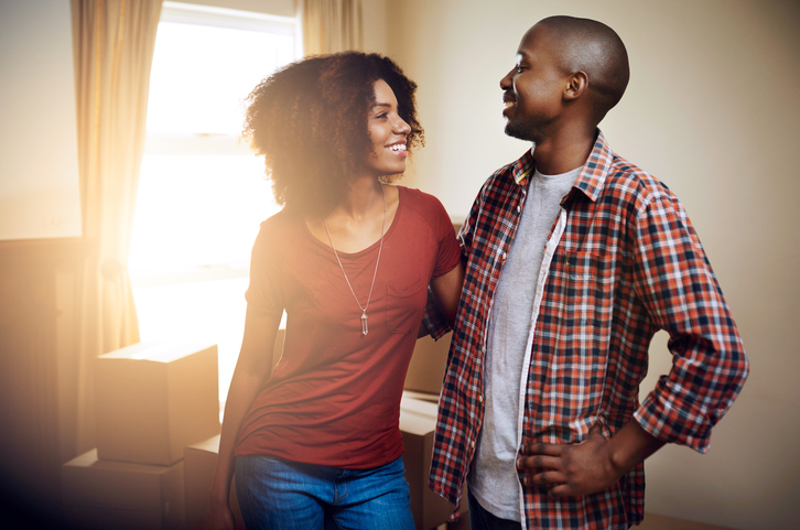 Cropped shot of a young couple moving into their new home