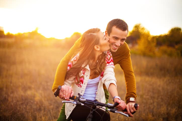 Loving couple having fun outdoors on a beautiful sunny day
