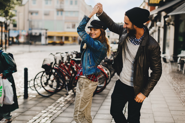 Close up of a happy young couple enjoying city life.