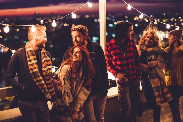 young friends party rooftop night