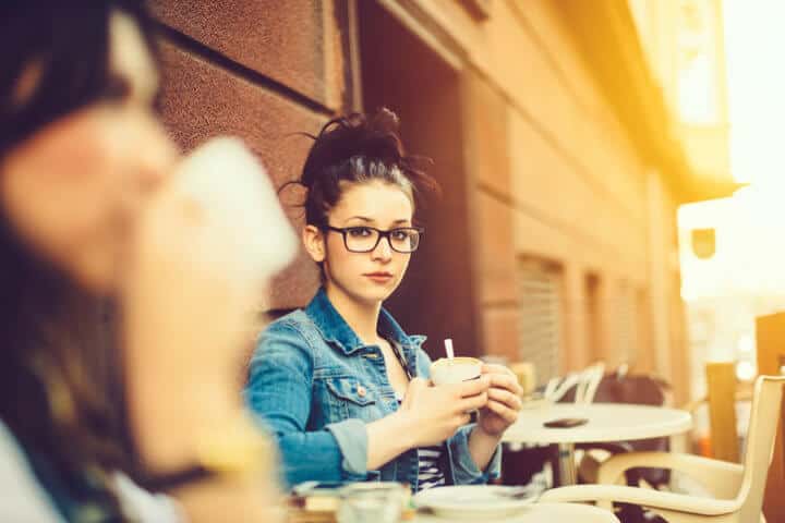 Young woman sitting table coffee
