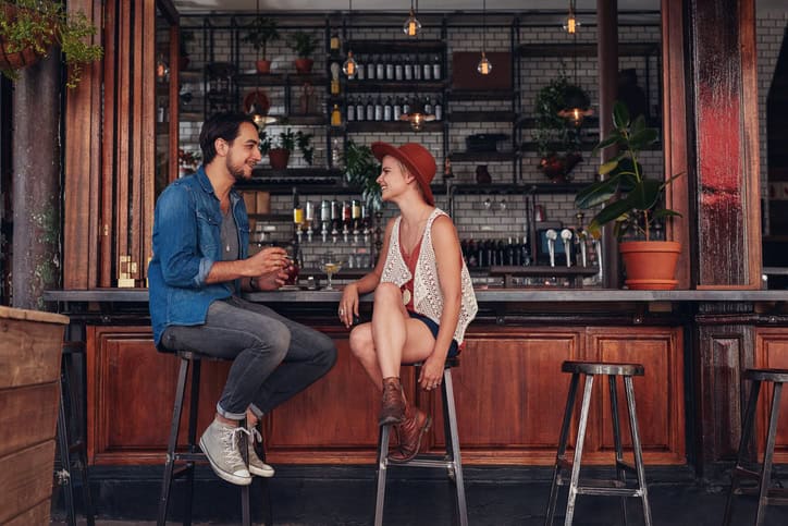 Young couple on a bar having a date.