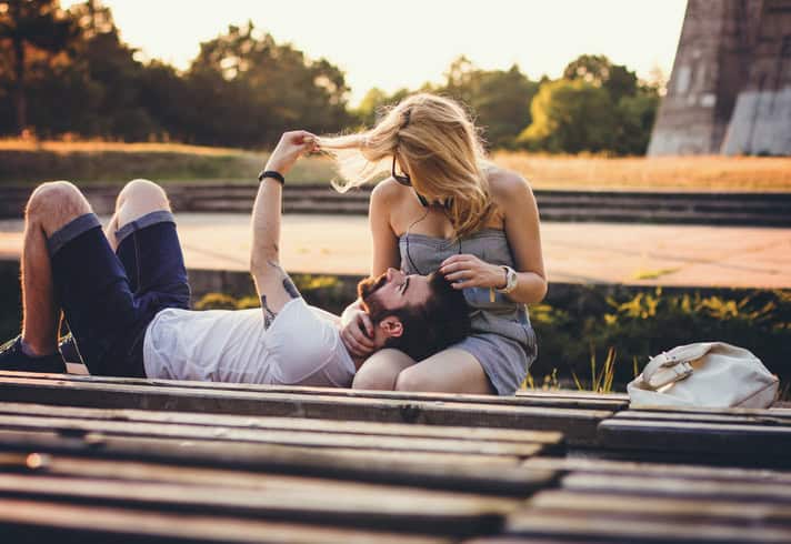 Young couple enjoying to nice weather at the park