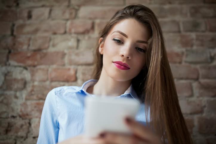 young woman texting phone