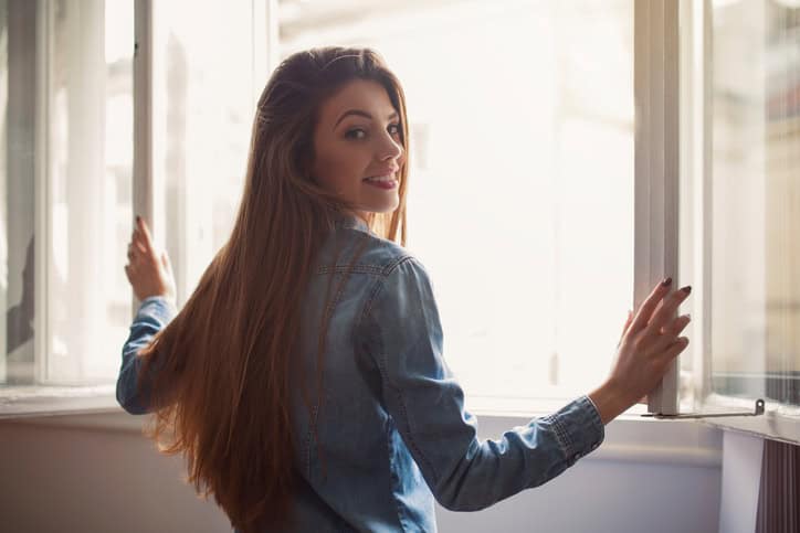 young woman window outside beautiful portrait