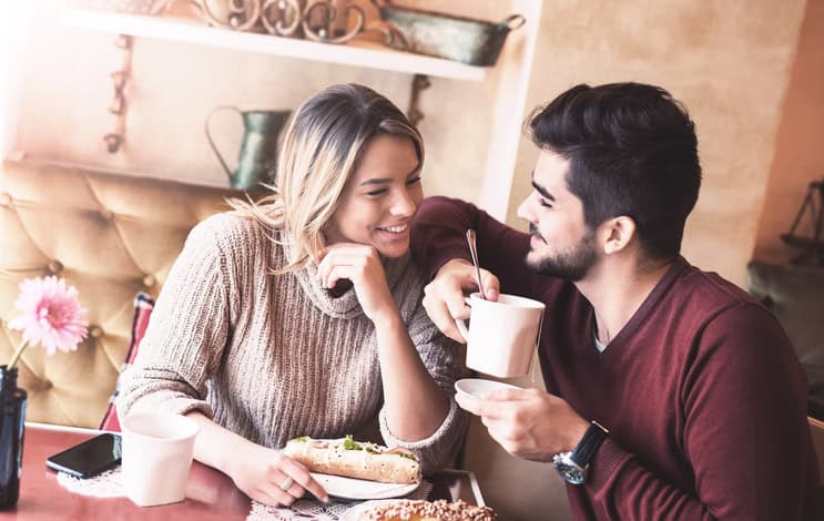 Handsome loving couple flirting in a cafe. Love and romance. Lifestyle concept