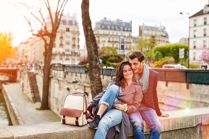 happy couple embracing in park